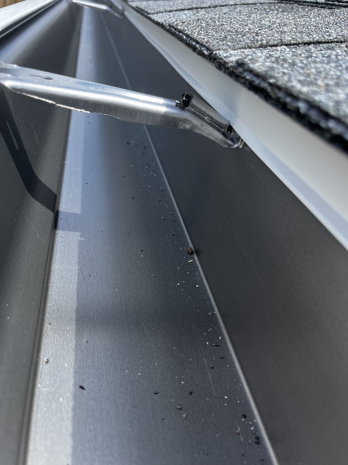 A clean gutter line and downspout outlet, close up, by Gutter And Covers, Cookeville