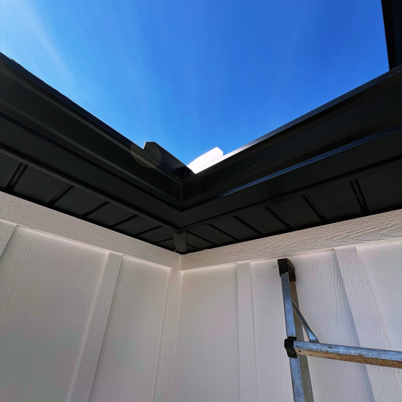 Evening light on a finished gutter and fascia line by Gutter And Covers, Cookeville